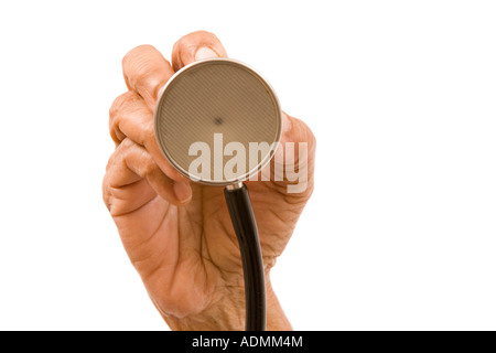 Elderly female doctor's hand holding the chest piece of a stethoscope towards a patient. Isolated on white Stock Photo