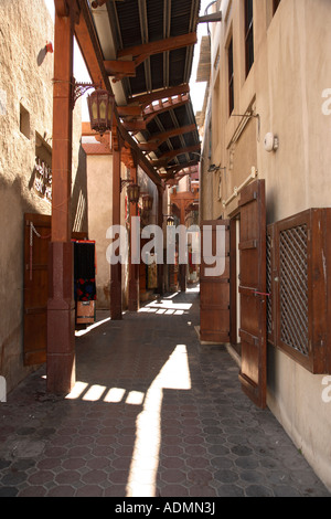 Narrow street through the textile souk Dubai city centre United Arab Emirates UAE Stock Photo