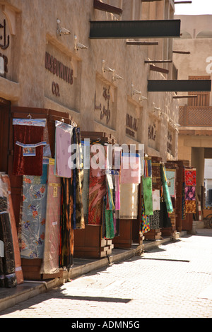 Narrow street in the textile souk Dubai city centre United Arab Emirates Stock Photo