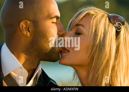Close Up Head and Shoulders Interracial love story of a black man and a white woman Stock Photo
