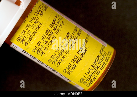 warning labels on prescription medicine bottle stock photo