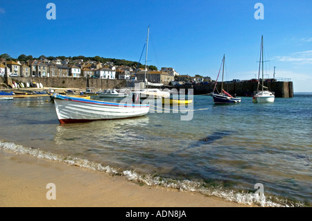fishing boats moored in the harbour at mousehole in cornwall,england Stock Photo