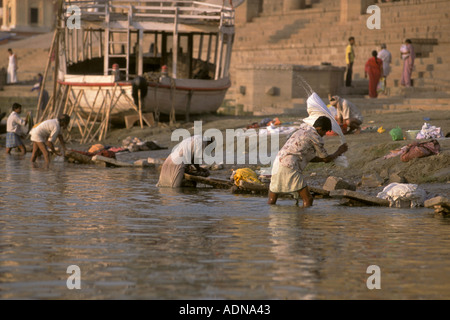 India Uttar Pradesh Varanasi Ganges River laundry men Stock Photo