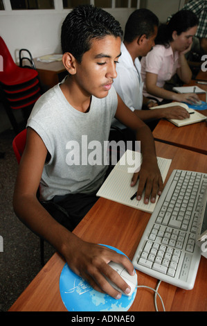 Boy at computer training at Joven Club Havana Cuba Stock Photo