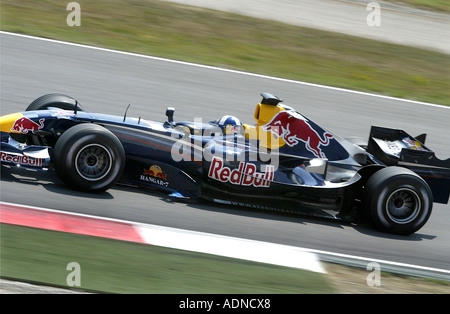 David Coultard, Red Bull Formula One driver driving at Montmelo circuit, Barcelona, Spain in 2006 Stock Photo