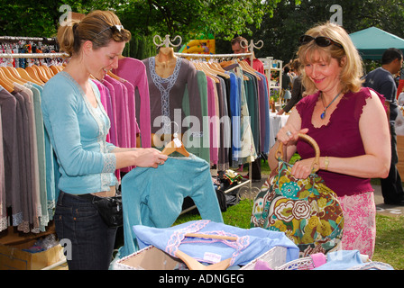 Women perusing clothes stall at Barnes Fair July 2007 Stock Photo