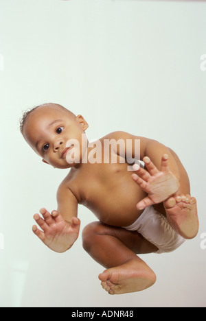 Low angle view of a baby boy sitting on all fours Stock Photo Alamy