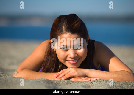 Woman laying on the beach Stock Photo