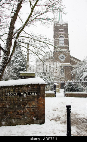 Snow covered St John At Hampstead Parish Church and graveyard Hampstead North London UK Stock Photo