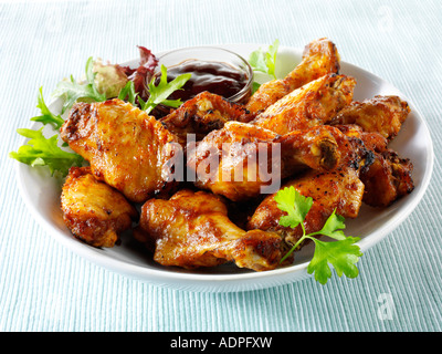 Bowl of spicy BBQ Chicken wings and thights Stock Photo