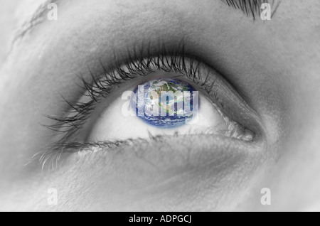 Extreme close up of womans eye with globe as iris digital composite Stock Photo