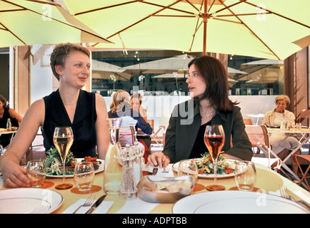 Paris France, Female Adults, Friends, Eating Lunch in Trendy Restaurant, French life, Sharing Meals, French customs champagne Stock Photo