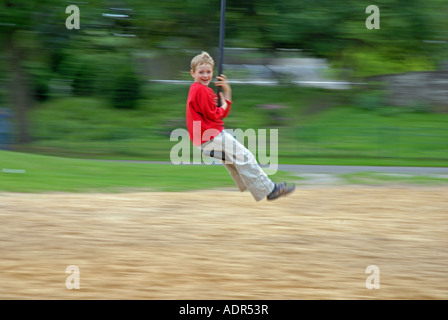 boy on playground with cable railway, Germany Stock Photo