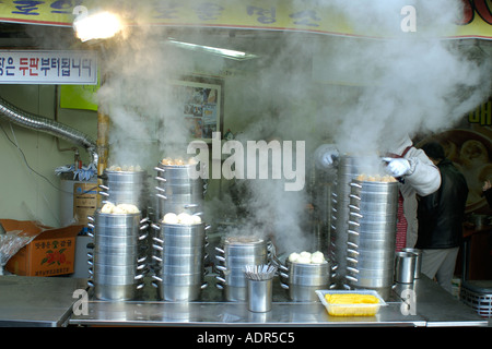 Steaming mandoo or korean dumplings at Food stall near Insadong street Seoul Gyeonggi Do South Korea Stock Photo