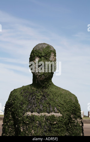 Anthony Gormley Another Place a series of figure sculptures on the beach at Crosby near Liverpool merseyside england Stock Photo