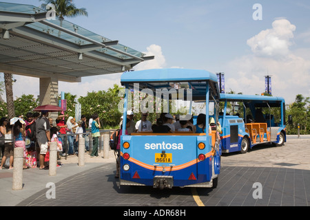 Sentosa Island Singapore Blue 'Beach Train' tram at new 'Beach Station' with tourist people queuing Stock Photo