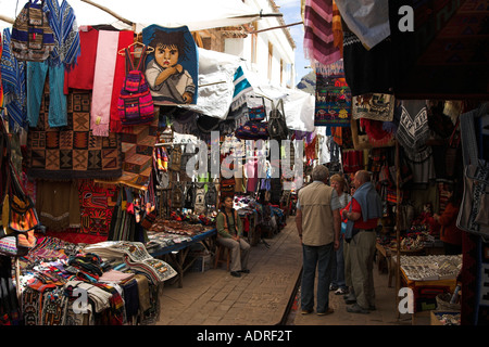 [Pisac Market], [Sacred Valley], Peru, 'South America', tourists and colourful market stalls selling peruvian textiles Stock Photo