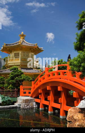 Gold Pagoda and red bridge over pond at Nan Lian Garden Hong Kong Stock Photo