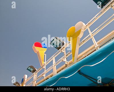colourful ice cream signs on top of shop Stock Photo