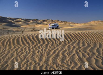 Adventure tourism with a 4x4 crossing sand dunes in Dhofar southern Oman Stock Photo