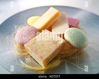 selection of natural hand made scented soap bars arranged on an aluminium dish Stock Photo