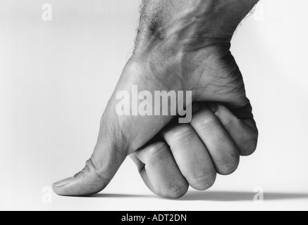 Thumb pressing down, (b&w), (close-up) Stock Photo