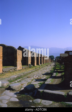 Main street of ancient Pompeii known as Decumanus Major at crossing with Via della Fortuna Stock Photo