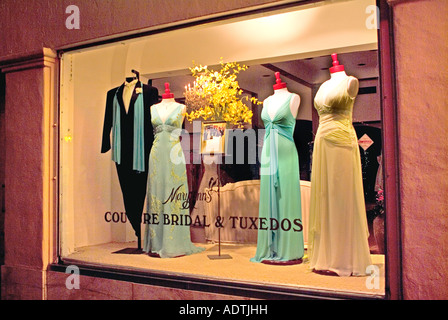 Luxurious gowns displayed in store window Stock Photo