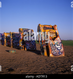 Old Cadillacs buried in teh ground at an angle at Cadillac Ranch near Amarillo, Texas. Stock Photo