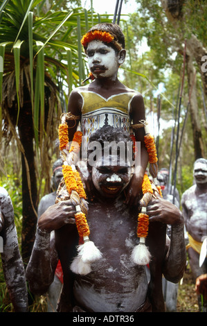 Yolngu Boy movie young aboriginal boy painted up with his dreaming carried on  shoulders during his initiation ceremony Stock Photo