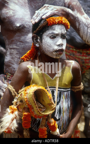 Yolngu Boy movie young aboriginal boy with his sacred dilly bag steadied by an elder at his initiation ceremony Arnhem Land Stock Photo