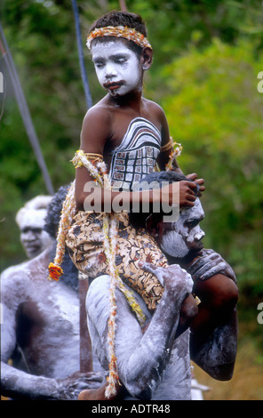 Yolngu Boy movie young aboriginal boy painted with his sacred dreaming totem carried to his initiation ceremony Arnhem Land Stock Photo