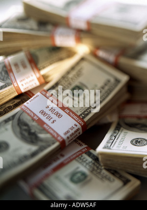 WADS OF 100 US DOLLARS BANKNOTES WITH GOLDEN BEAM Stock Photo