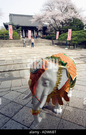 elephant statue in temple spring cherry tree blossom Nishi Otani Mausoleum temple Kyoto Japan Asia Stock Photo