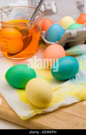 An assortment of colorful Easter eggs drying on paper towels Stock Photo