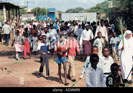 Palm Sunday procession of local people led by and Italian Nun in Isiolo Kenya East Africa Stock Photo