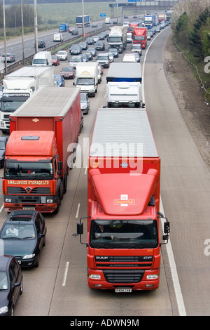 Royal Mail lorry travelling slowly among heavily congested traffic on M1 motorway in Hertfordshire United Kingdom Stock Photo