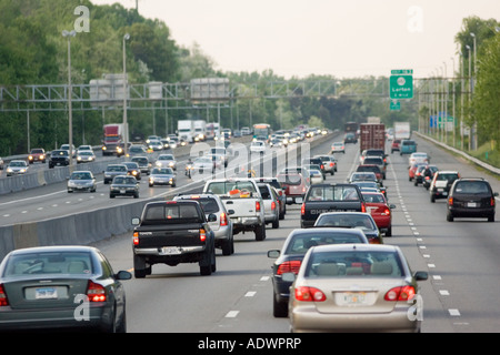 Heavy weight of traffic travelling on freeway lanes outskirts of Washington DC USA Stock Photo