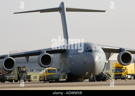 C17 transport plane and ground support at RAF Brize Norton in Oxfordshire United Kingdom Stock Photo