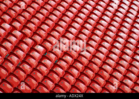 Rows of red seats in a soccer rugby football stadium Stock Photo