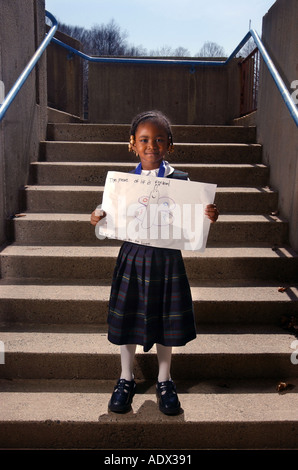 Small girl student with prize for national poetry contest Stock Photo