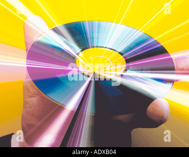 Concepts cd compact disc hand holding reflective media data information cd r cd rw music programs technology computer Stock Photo