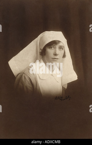 Original studio portrait photograph of pretty WW1 era nurse, Tunbridge Wells, Kent, England, U.K. Circa 1917 / 1918 Stock Photo