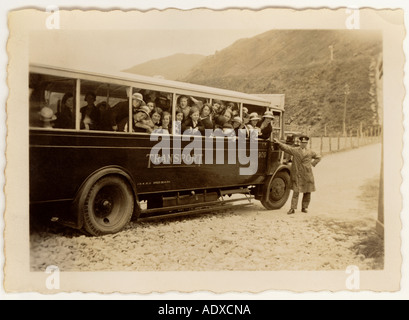 School children on a bus which dates from the 1920's or 1930's on a day trip, pastimes, U.K. Stock Photo