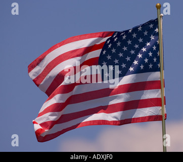 American flag waving against blue sky Stock Photo - Alamy