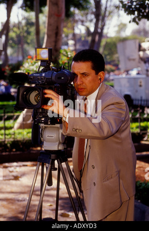 1, one, Mexican man, cameraman, filming on location, Plaza Hidalgo, Coyoacan, Mexico City, Federal District, Mexico Stock Photo