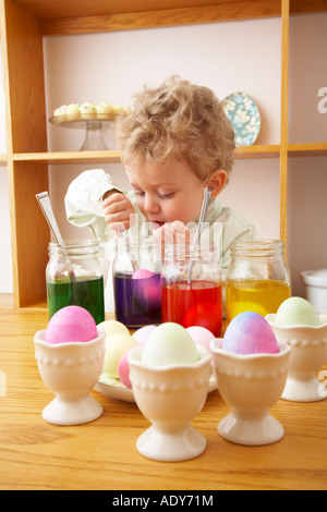 Child Making Easter Eggs Stock Photo