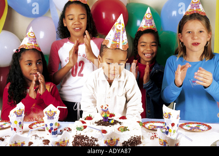 Celebrations I cake cakes kids singing song clapping hands topping icing sweets sweet kid s party strawberries cardboard dishes Stock Photo