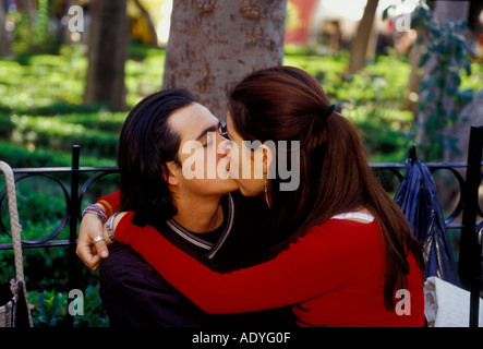 Mexican people, couple, young man and woman kissing, kissing on lips, pda, Centenario Garden, Coyoacan, Mexico City, Federal District, Mexico Stock Photo