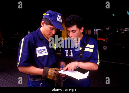 2, two, Mexicans, Mexican men, baggage handlers, ground crew, passenger luggage, Benito Juarez International Airport, Mexico City, Mexico Stock Photo